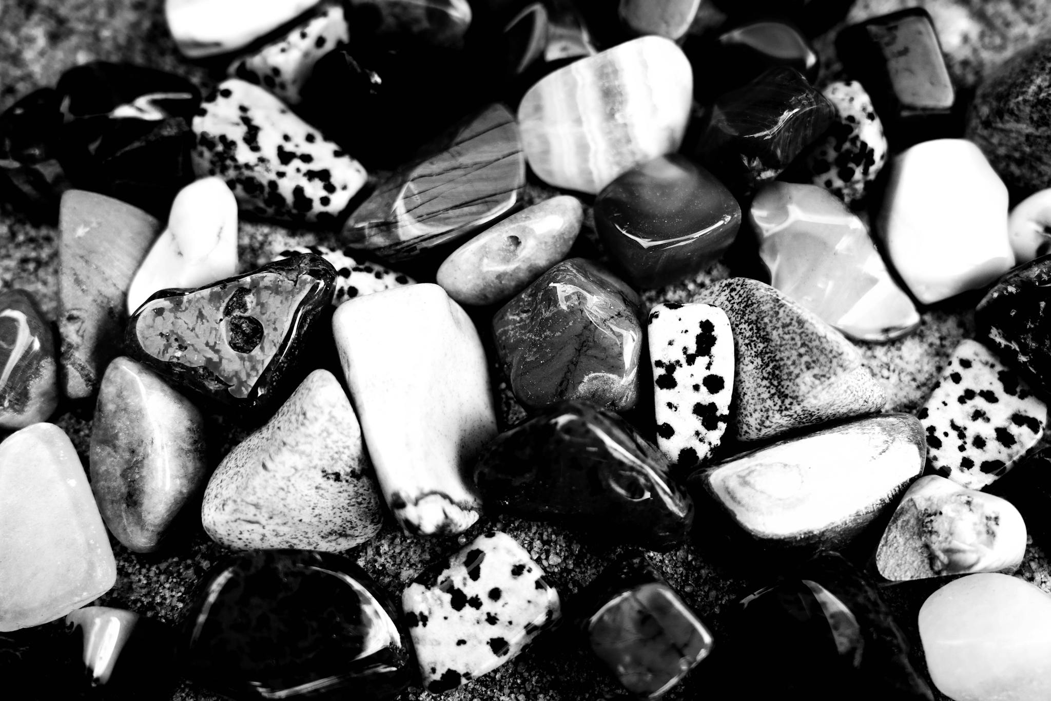 Beautiful arrangement of polished stones showcasing various textures and patterns.
